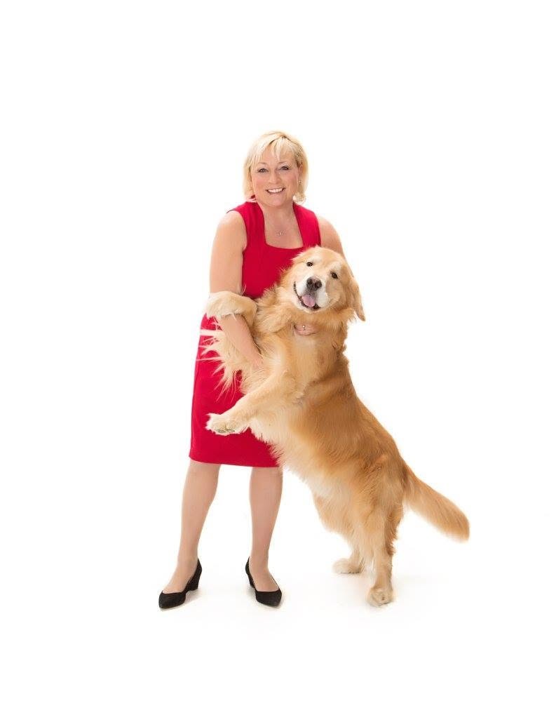 Nancy Brown, owner of Hot Diggity Dog, with a golden retriever